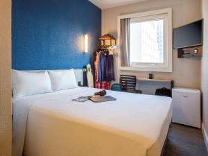 Cama ou camas em um quarto em ibis budget Sao Paulo Morumbi mais 37 fotos