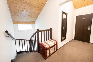 A bed or beds in a room at Hotel U Šuláka