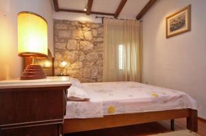 Postel nebo postele na pokoji v ubytování Rilović House