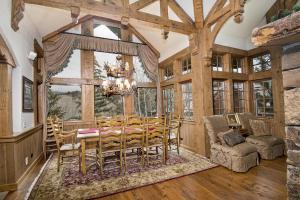 a dining room with a table and chairs and a window at 349 Holden Rd, home in Beaver Creek