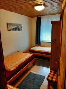 Postel nebo postele na pokoji v ubytování Gästehaus Rüger