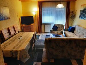 TV a/nebo společenská místnost v ubytování Gästehaus Rüger