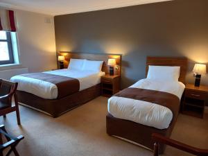 Łóżko lub łóżka w pokoju w obiekcie Hillcrest Guest House