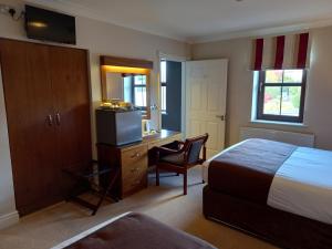 Een bed of bedden in een kamer bij Hillcrest Guest House