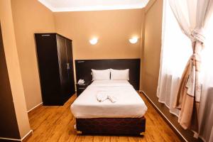 Katil atau katil-katil dalam bilik di Panone Hotel-Chekereni