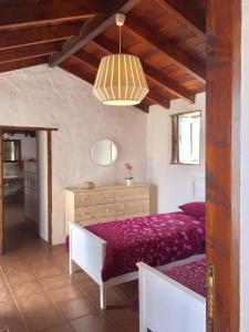 מיטה או מיטות בחדר ב-Finca Los Llanitos