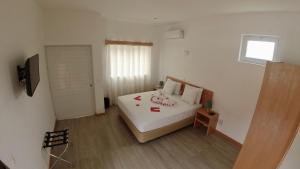 En eller flere senger på et rom på Hotel São Jorge village