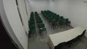 an overhead view of a room with green chairs and tables at Hotel São Jorge village in Órgãos +44 photos