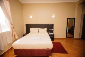 Cama o camas de una habitación en Panone Hotel Boma