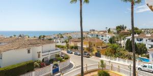 a view of a street in a town with palm trees at Apartment Near to Beach, Max Beach Club La Riviera-Mijas in Mijas