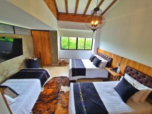 Postel nebo postele na pokoji v ubytování Hacienda Isabela Hotel Campestre