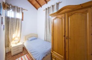 Ένα ή περισσότερα κρεβάτια σε δωμάτιο στο Tenerife Paradise 01 Chalet - Hotel Rural Fsj