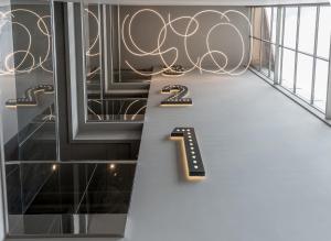 a staircase with a number on the side of a building at Hotel Antik San Sebastián in Donostia-San Sebastián