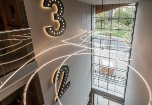 a spiral staircase with a number on the wall at Hotel Antik San Sebastián in Donostia-San Sebastián