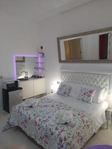 Postel nebo postele na pokoji v ubytování BB La Bella Addormentata e il Principe Calaf