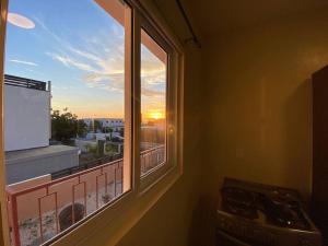 Pogled na izlazak ili zalazak sunca iz ili blizu apartmana