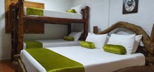 Postel nebo postele na pokoji v ubytování Hacienda Isabela Hotel Campestre
