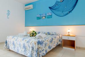 Letto o letti in una camera di Scialabà Residence Salento
