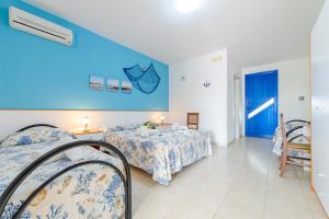 Letto o letti in una camera di Scialabà Residence Salento
