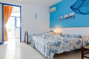 Letto o letti in una camera di Scialabà Residence Salento