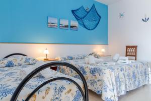 Letto o letti in una camera di Scialabà Residence Salento