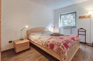 Кровать или кровати в номере Residence La Contea