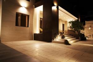 a building with stairs and lights on the side of it at B&B Villa Grace in Bari