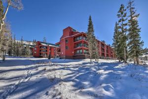 a large red building in the snow with trees at The Bunk House - Ski-InandSki-Out at Giant Steps! in Brian Head