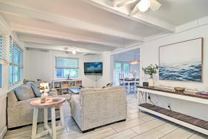 a living room with a couch and a fireplace at Retreat Half-Mile to BeachandSiesta Key Village in Siesta Key