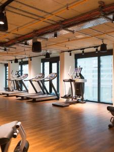 a gym with a row of pilates equipment in a room at Cosy Studios and Apartments at Chapter Aldgate in London in London