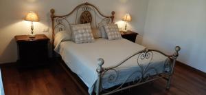 Un pat sau paturi într-o cameră la Casa Al Lago