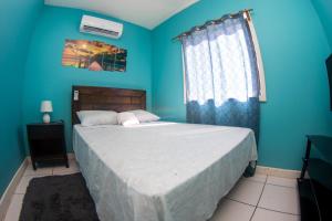 Tempat tidur dalam kamar di Bliss on the Bay Single Bed