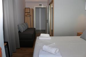 Postel nebo postele na pokoji v ubytování Oneiro Zois