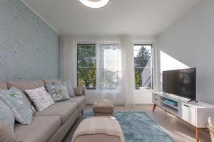 A television and/or entertainment centre at VeronikApartman - brand new & cozy - with underground garage