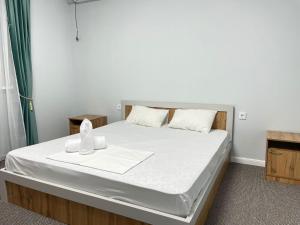 Кровать или кровати в номере Мунайшы