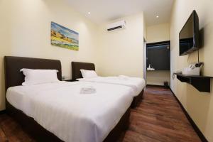 Postel nebo postele na pokoji v ubytování Hotel Le-Shore