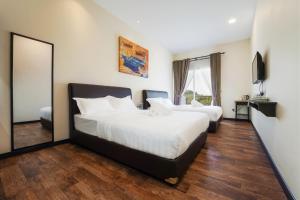 Postel nebo postele na pokoji v ubytování Hotel Le-Shore