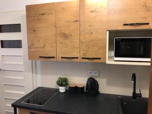 Kuchyňa alebo kuchynka v ubytovaní Apartament Dolce Vita Kościelisko Resort + 6 fotografií