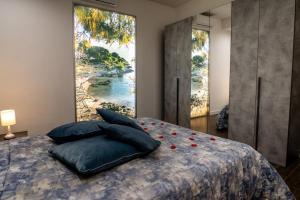 Кровать или кровати в номере Resort Villa La Perla Sul Mare