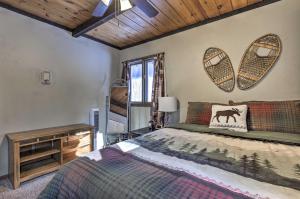 a bedroom with a bed and a wooden ceiling at The Lodge at Valhalla at Powderhorn Ski Resort! in Bessemer
