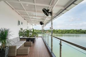 a balcony with a view of the water at Hotel Le-Shore in Kuala Selangor