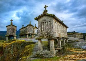 an old church on the side of a hill at Casa João Rodas in Soajo