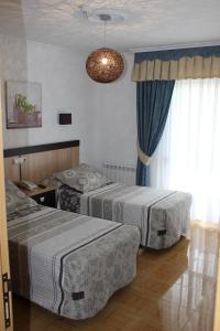 Posteľ alebo postele v izbe v ubytovaní Hotel Estrella del Mar