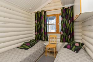 Postel nebo postele na pokoji v ubytování Hallan Akka Apartments