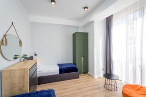 Postel nebo postele na pokoji v ubytování Light and stylish 2 bedroom apartment near the Gondola lift in New Gudauri