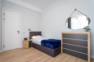 Postel nebo postele na pokoji v ubytování Light and stylish 2 bedroom apartment near the Gondola lift in New Gudauri