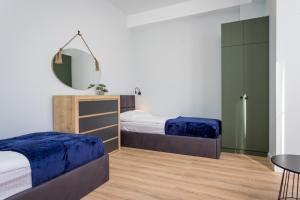 Postel nebo postele na pokoji v ubytování Light and stylish 2 bedroom apartment near the Gondola lift in New Gudauri + 23 fotografií