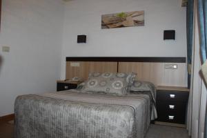Posteľ alebo postele v izbe v ubytovaní Hotel Estrella del Mar