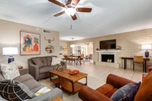 a living room with couches and a couch and a table at Casa Feliz Old Town Condo with Pool by Downtown! in Scottsdale