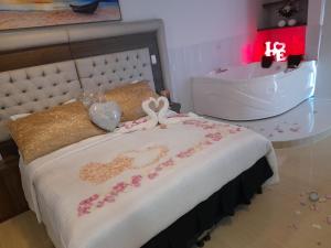 Postel nebo postele na pokoji v ubytování Hotel San Antonio Guarne